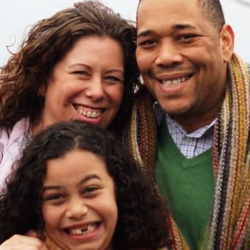 A photo shows parents and kids